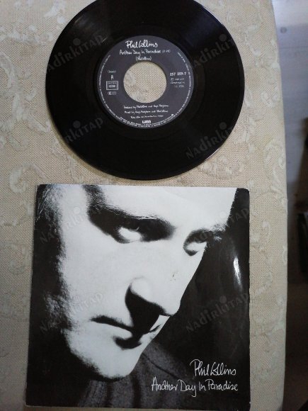 PHIL COLLINS- ANOTHER DAY IN PARADISE/ HEAT ON THE STREET - 1989 FRANSA BASIM 45’LİK  PLAK