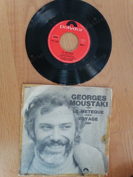 GEORGES MOUSTAKI - LE METEQUE 1969 FRANSA BASIM 45 LİK PLAK ( KAPAK YIPRANMIŞTIR AÇIKLMAYI OKUYUNUZ )